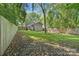 Large backyard with a fence, lush greenery, and potential for outdoor activities at 2117 Camp Greene St, Charlotte, NC 28208