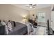 Inviting bedroom featuring a ceiling fan, offering a relaxing retreat and natural lighting at 2117 Camp Greene St, Charlotte, NC 28208