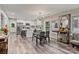 Open-concept dining area with modern lighting, seamlessly connected to the kitchen and living space at 2117 Camp Greene St, Charlotte, NC 28208