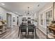 Open concept dining room featuring modern lighting and direct access to the kitchen and views to the outside at 2117 Camp Greene St, Charlotte, NC 28208