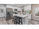 Bright kitchen featuring white cabinets, stainless steel appliances, and a quartz countertop island at 2117 Camp Greene St, Charlotte, NC 28208