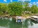 Beautiful aerial shot of a two-story boat dock and waterfront, perfect for serene lake living at 21220 Rio Oro Dr, Cornelius, NC 28031