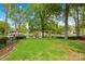 Expansive backyard with a well-manicured lawn, leading to picturesque waterfront views at 21220 Rio Oro Dr, Cornelius, NC 28031