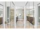 Luxurious bathroom featuring dual vanities, a glass shower, and modern fixtures at 21220 Rio Oro Dr, Cornelius, NC 28031