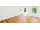 Empty bedroom with hardwood floors offers bright natural light and space to customize at 21220 Rio Oro Dr, Cornelius, NC 28031