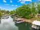 Stunning lakefront property featuring a modern two-story boat dock, perfect for enjoying the water at 21220 Rio Oro Dr, Cornelius, NC 28031