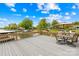 Spacious deck offers a great outdoor space for entertaining, with lake views and ample seating under the umbrella at 21220 Rio Oro Dr, Cornelius, NC 28031