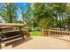 Inviting backyard deck features a comfortable swing and views of the waterfront, creating a relaxing outdoor space at 21220 Rio Oro Dr, Cornelius, NC 28031