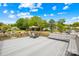 Spacious deck offers a great outdoor space for entertaining, with lake views and ample seating under the umbrella at 21220 Rio Oro Dr, Cornelius, NC 28031