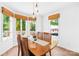 Bright dining room features a wood table with seating for six and bright natural lighting at 21220 Rio Oro Dr, Cornelius, NC 28031