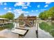 Lakefront property featuring a private dock with a boat lift and upper deck area, perfect for enjoying waterfront living at 21220 Rio Oro Dr, Cornelius, NC 28031