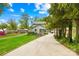 Charming home with a well-manicured lawn, long driveway, and inviting facade at 21220 Rio Oro Dr, Cornelius, NC 28031