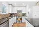 Well-lit kitchen featuring stainless steel appliances and decorative tile backsplash at 21220 Rio Oro Dr, Cornelius, NC 28031