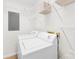 Clean laundry room with a new washer and dryer and wire shelving for storage at 21220 Rio Oro Dr, Cornelius, NC 28031