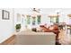 Bright living room with hardwood floors, white brick fireplace, and access to the outdoor deck at 21220 Rio Oro Dr, Cornelius, NC 28031