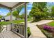 Charming front porch with a view of the well-manicured lawn and colorful azaleas, enhancing the curb appeal at 21220 Rio Oro Dr, Cornelius, NC 28031