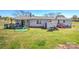 Backyard with a shed, lawn mower, and wooden stairs at 216 Sylvan Rd, China Grove, NC 28023