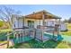 The backyard features a deck with a covered awning and wooden lattice at 216 Sylvan Rd, China Grove, NC 28023