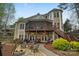 Home featuring a screened porch, wood deck, stone patio, fire pit and a lush green yard perfect for outdoor entertaining at 2228 Metcalf Dr, Sherrills Ford, NC 28673