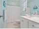 Clean bathroom with a shower and tub combination, bright window, and essential fixtures, offering comfort and convenience at 2228 Metcalf Dr, Sherrills Ford, NC 28673