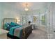 Stylish bedroom featuring unique decor, a chandelier, and natural light from the windows, creating a chic retreat at 2228 Metcalf Dr, Sherrills Ford, NC 28673