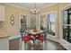 Charming breakfast nook with views of the water and decorative chandelier at 2228 Metcalf Dr, Sherrills Ford, NC 28673