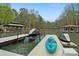 Dock features a kayak and boat lift and has views of the lake and boathouses at 2228 Metcalf Dr, Sherrills Ford, NC 28673
