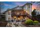 Back exterior with spacious screened porch, deck and an outdoor seating area with fire pit for entertaining guests at 2228 Metcalf Dr, Sherrills Ford, NC 28673