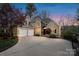 Inviting two-story home featuring a two-car garage, manicured landscaping, and elegant stone accents at 2228 Metcalf Dr, Sherrills Ford, NC 28673