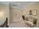 Inviting hallway with neutral colors, decorative art, and a comfortable bench, creating a welcoming space at 2228 Metcalf Dr, Sherrills Ford, NC 28673