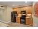 Modern kitchen features stainless steel appliances and wood cabinets at 2228 Metcalf Dr, Sherrills Ford, NC 28673