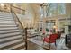 Grand living room featuring high ceilings, large windows, hardwood floors, and an open floor plan at 2228 Metcalf Dr, Sherrills Ford, NC 28673