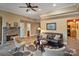Inviting living room featuring a stone fireplace, cozy seating, and backyard access offering comfort and style at 2228 Metcalf Dr, Sherrills Ford, NC 28673