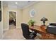 Functional home office area with a wooden desk, office chair, and natural light, ideal for productivity at 2228 Metcalf Dr, Sherrills Ford, NC 28673