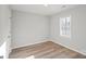 Bedroom with a window for natural light, neutral walls, and hard wood floors at 243 Barber St, Rock Hill, SC 29730