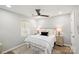 Comfortable bedroom featuring a ceiling fan, neutral walls, a window for natural light and hardwood floors at 243 Barber St, Rock Hill, SC 29730
