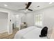 Bright bedroom with a ceiling fan, neutral walls, a window for natural light, and a view to a bathroom at 243 Barber St, Rock Hill, SC 29730