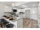 Modern kitchen featuring white cabinets, granite countertops, stainless steel appliances, and a convenient breakfast bar at 243 Barber St, Rock Hill, SC 29730