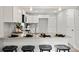 Modern kitchen featuring white cabinets, granite countertops, stainless steel appliances, and a convenient breakfast bar at 243 Barber St, Rock Hill, SC 29730