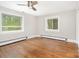 Bedroom featuring hardwood floors, neutral walls, and lots of natural light at 2714 Dogwood Cir, Charlotte, NC 28208