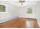 Bright bedroom with hardwood floors, neutral walls, and lots of natural light at 2714 Dogwood Cir, Charlotte, NC 28208