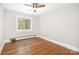Bedroom featuring hardwood floors, neutral walls, and lots of natural light at 2714 Dogwood Cir, Charlotte, NC 28208