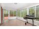 Bright sunroom featuring large windows, natural light, and a black grill at 2714 Dogwood Cir, Charlotte, NC 28208
