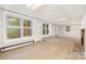 Bright sunroom featuring large windows, natural light, and neutral paint at 2714 Dogwood Cir, Charlotte, NC 28208
