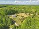 Aerial view of a brick home with a lush green landscape surrounding it at 2805 Sadler Rd, Alexis, NC 28006