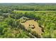 An aerial view showcasing the property nestled among lush greenery and serene landscapes at 2805 Sadler Rd, Alexis, NC 28006