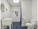 Bathroom with blue tile flooring, toilet and pedestal sink at 2805 Sadler Rd, Alexis, NC 28006