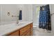 Bathroom with wood vanity and patterned shower curtain at 2805 Sadler Rd, Alexis, NC 28006