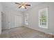 Bright, carpeted bedroom with closet and sunny window at 2805 Sadler Rd, Alexis, NC 28006