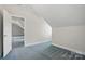 Angled bedroom with blue carpet and open doorway at 2805 Sadler Rd, Alexis, NC 28006